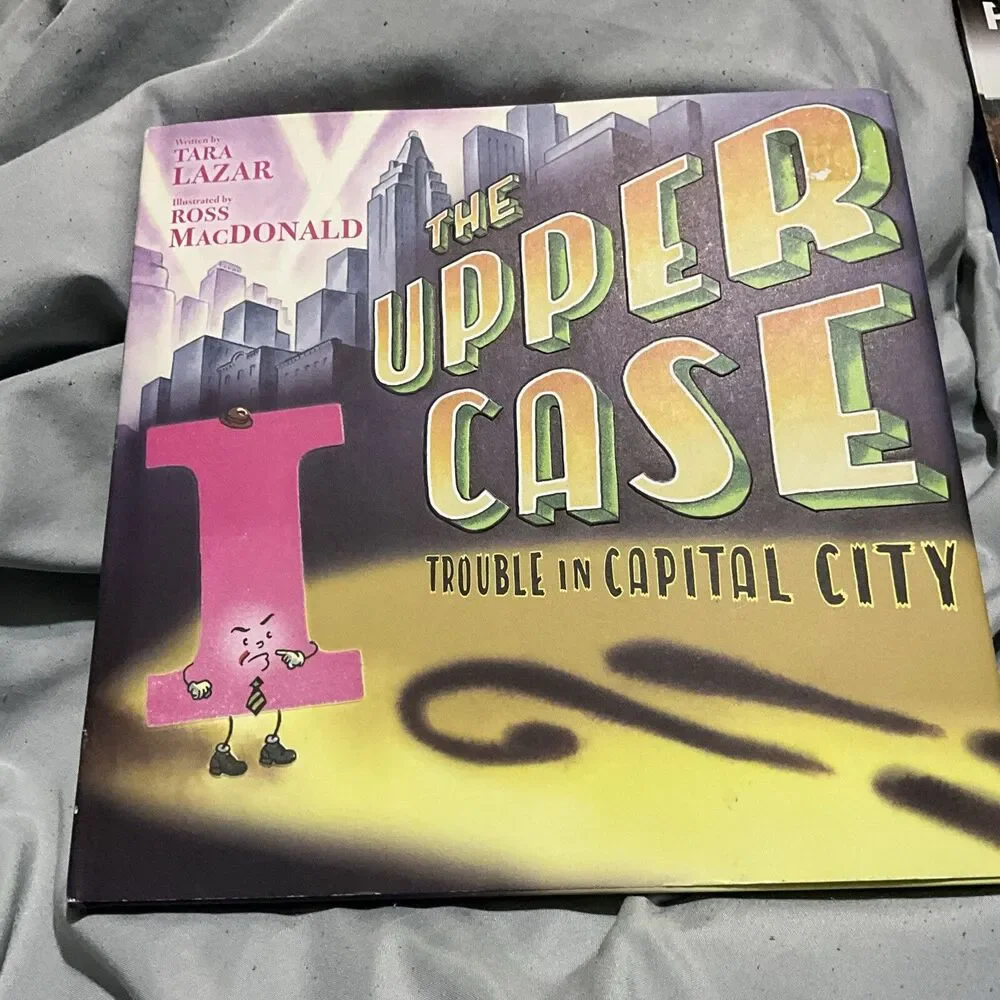THE UPPER CASE TROUBLE IN CAPITAL CITY HARDCOVER W/ DUST COVER 1ST ED. 2019 NEW